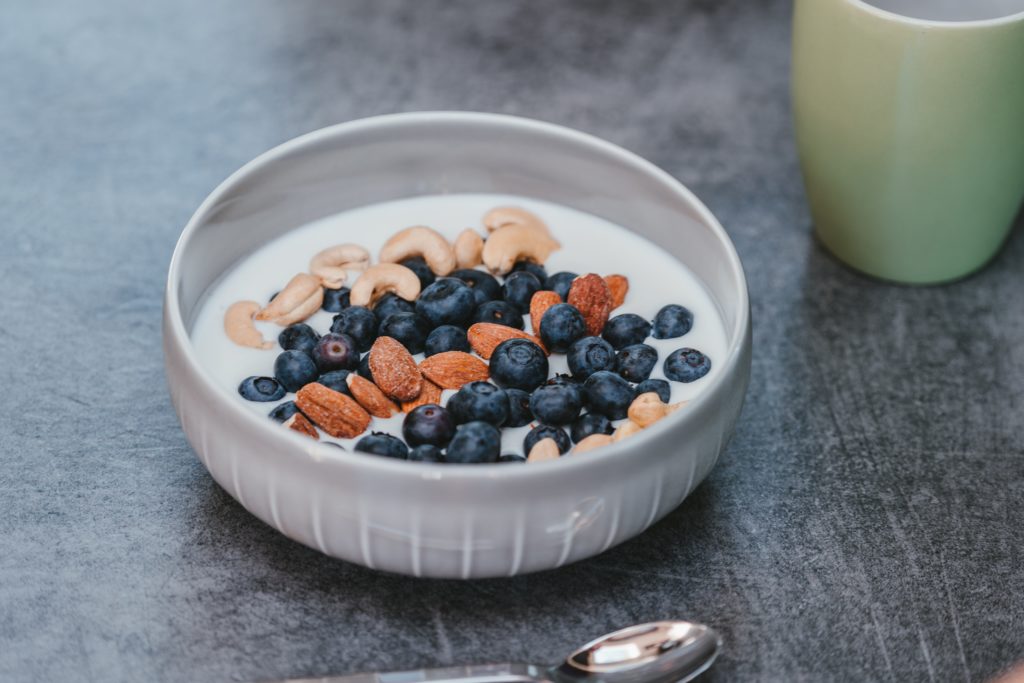 Plain Greek yoghurt, bluberries and nuts for The Best Foods To Feed Your Vagina